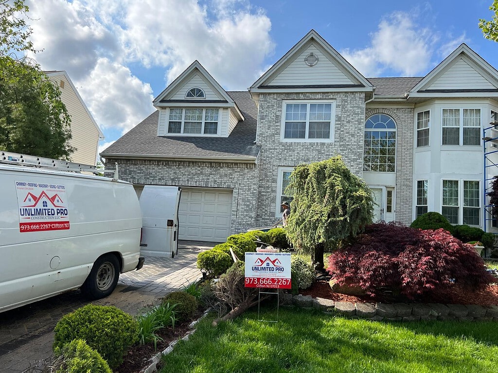 Unlimited Pro van in front of a newly roofed New Jersey home
